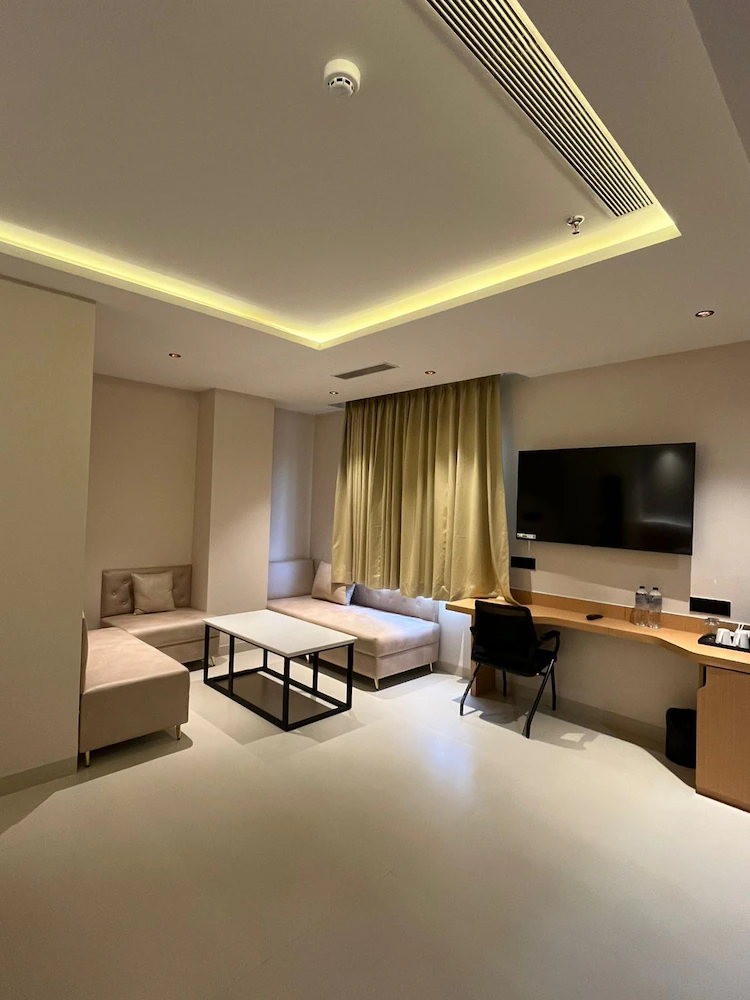 Room with work desk and wardrobe